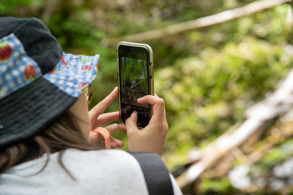 Girl taking photo on iPhone